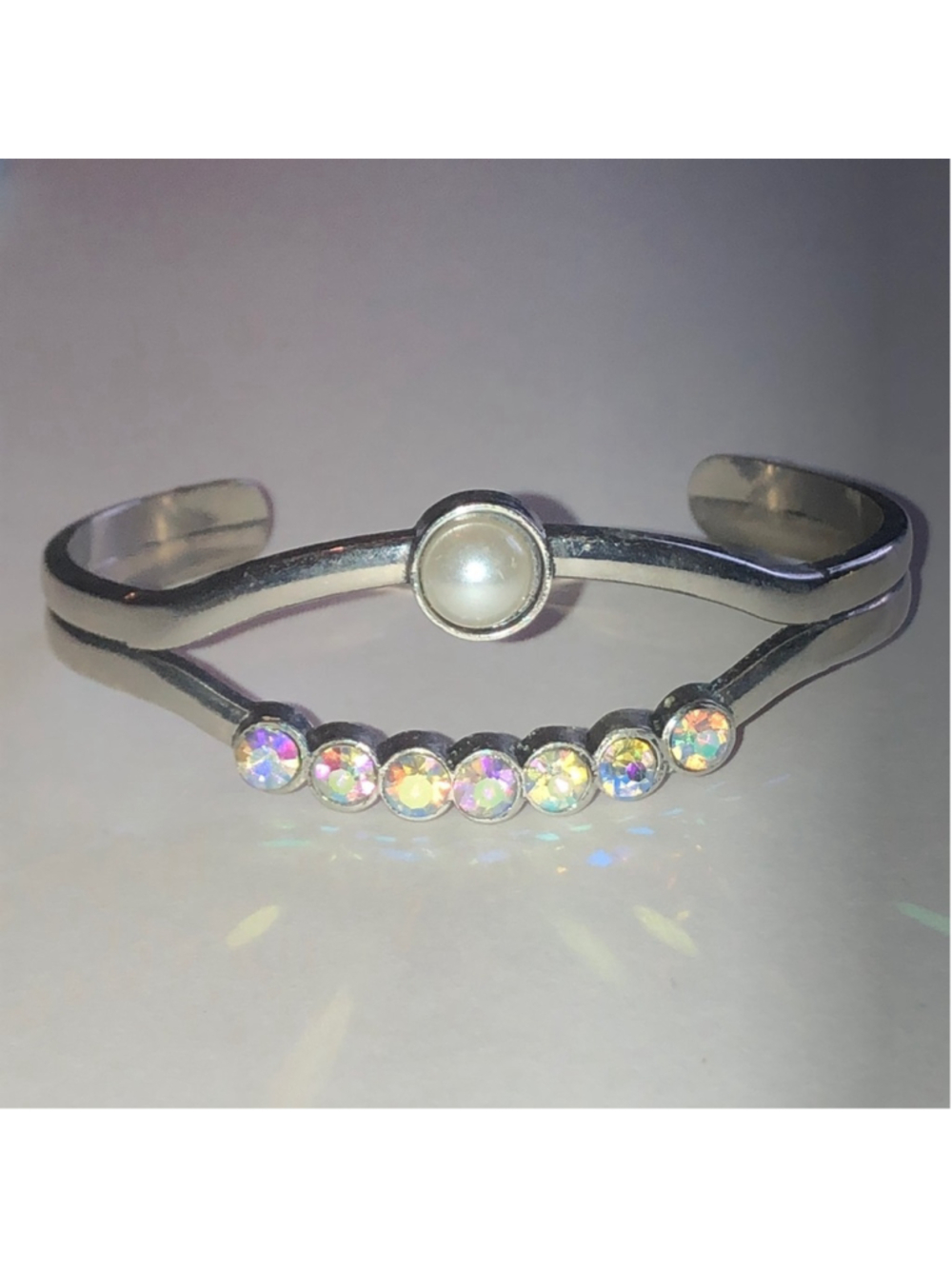 Silver Tone Cuff Bracelet with Faux Pearl Accent and Iridescent Rhinestone Row